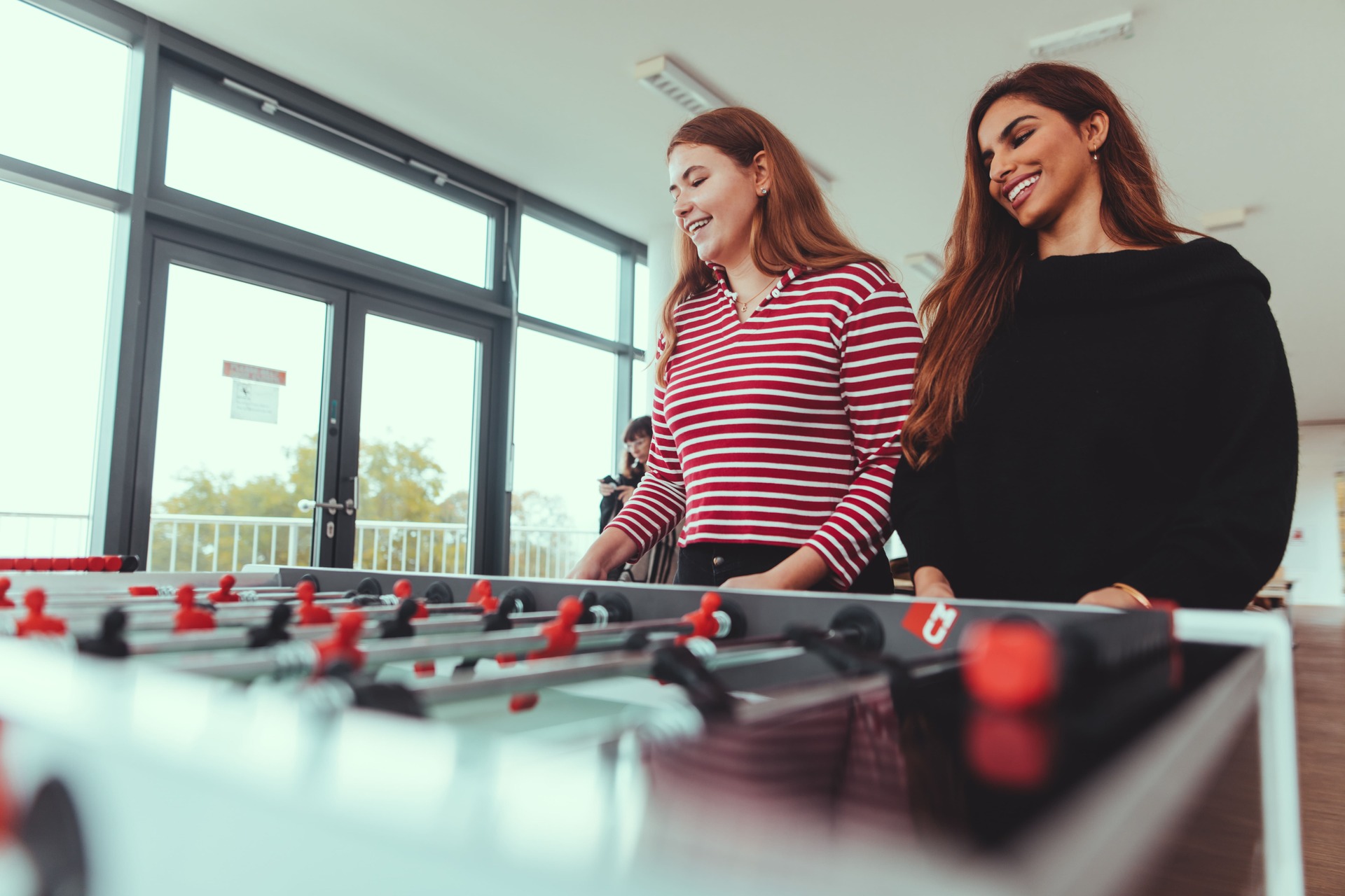 Students Playing Foosball Students playing foosball